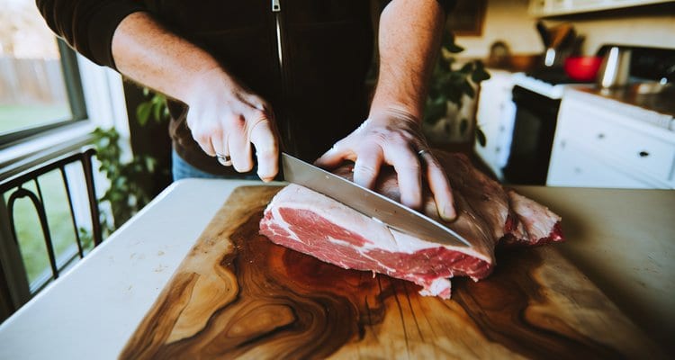 Trimming fat cap on competition brisket to quarter inch Trimming fat cap on competition brisket to quarter inch