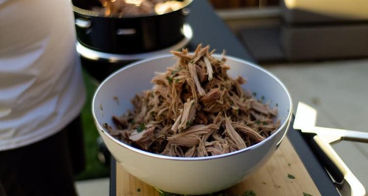 Finished pulled pork shoulder shredded and ready to serve Finished pulled pork shoulder shredded and ready to serve