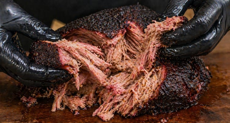 Guide to BBQ Bark Guide to BBQ Bark — dark crusty exterior on smoked brisket showing smoke ring