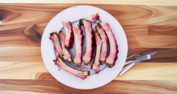 Sliced Smoked Spare Ribs Sliced smoked ribs arranged on a plate